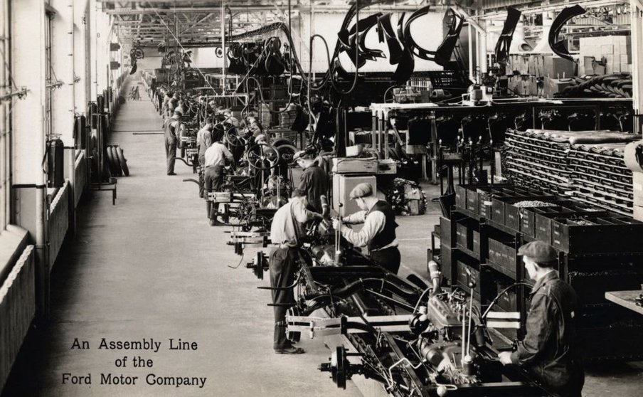 An Assembly Line of the Ford Motor Company. The assembly line is always a point of interest to visitors of the Rouge Plant. Here, on a moving conveyor, Ford cars are completely assembled, from the chassis to finished car, and driven off the line under their own power. In addition to the Rouge plant, there are 31 assembly lines in company branches throughout the United States. --- Image by © Rykoff Collection/CORBIS